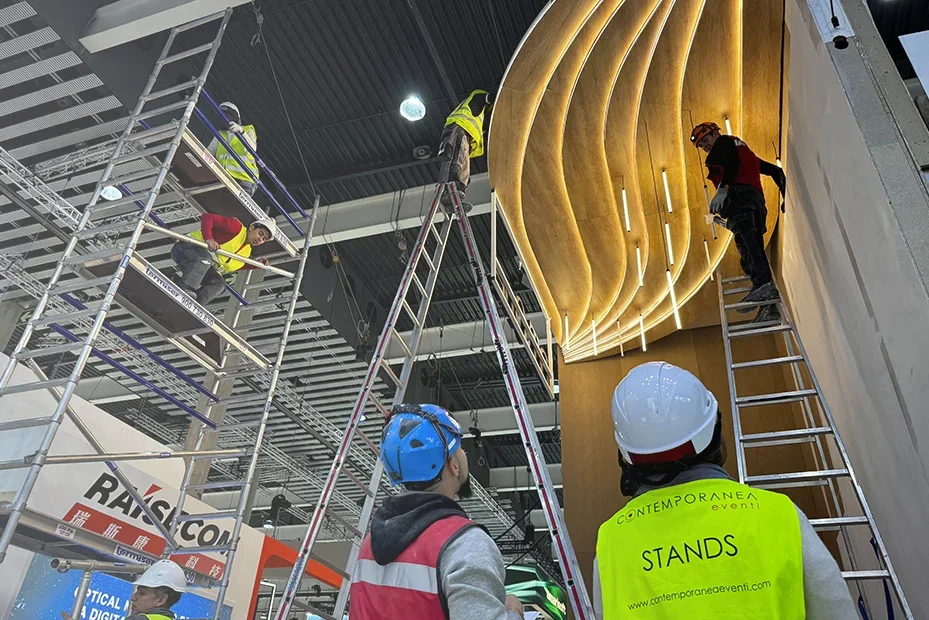 Exhibition stand builders assembling a bespoke custom trade show stand